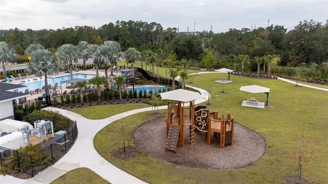 a view of a swimming pool with a patio
