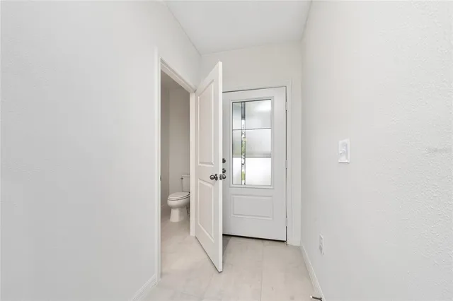 an empty room with mirror