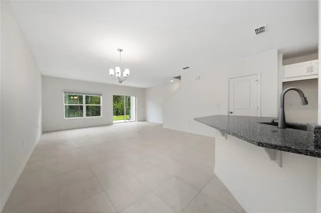 a view of a kitchen with a sink and a window