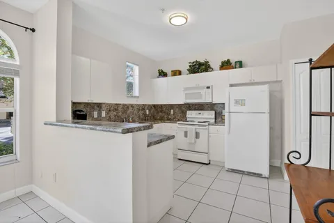 $345,000 | 100 Jacaranda Country Club Drive, Unit 101, Plantation, FL 33324