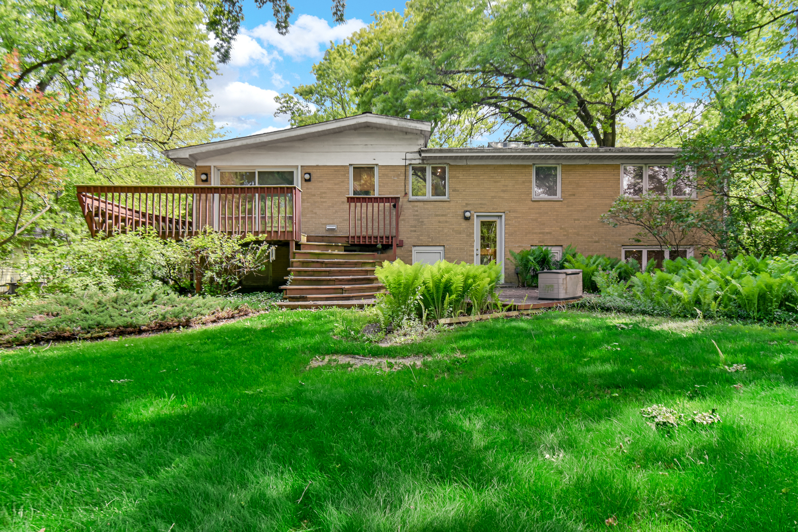 4112 Sunset Road Matteson, IL 60443 - Photo 21 of 28 a view of a yard in front of a house with plants and large tree