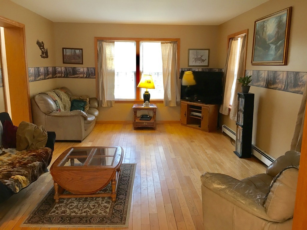12 Sampson Road Huntington, MA 01050 - Photo 1 of 29 a living room with furniture and a flat screen tv