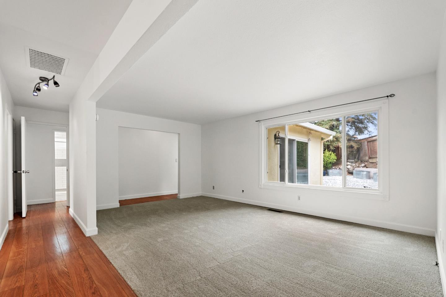 1091 Century Drive Napa, CA 94558 - Photo 15 of 53 a view of an empty room with a window and wooden floor
