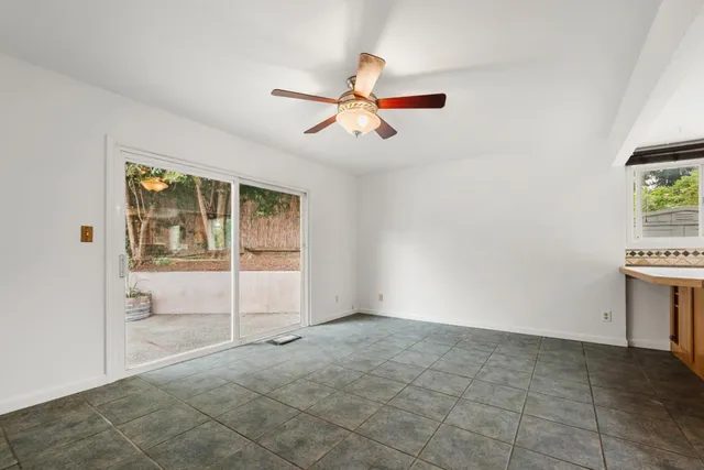 a kitchen with a stove a sink and a refrigerator