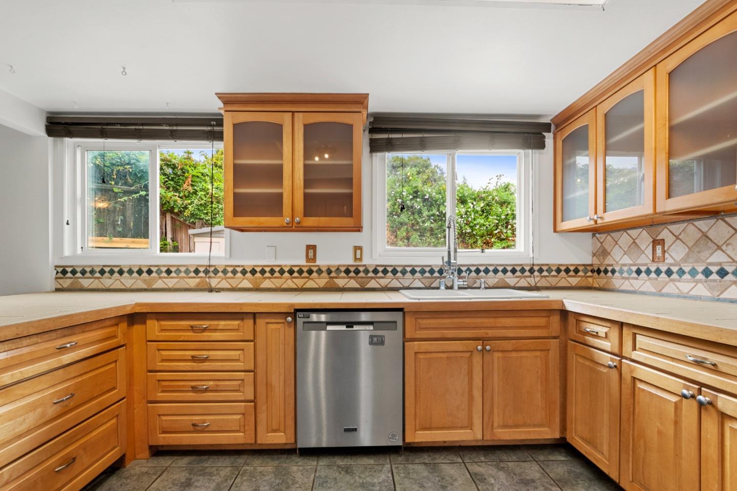 1091 Century Drive Napa, CA 94558 - Photo 27 of 53 a kitchen with granite countertop white cabinets and a window