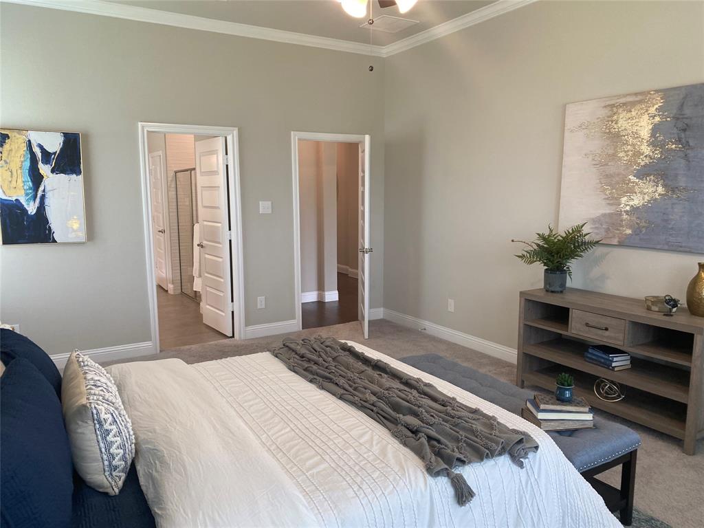 209 Johnson Street Granbury, TX 76048 - Photo 25 of 40 Carpeted bedroom with ornamental molding