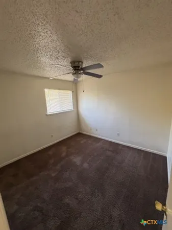 a view of a room has a window