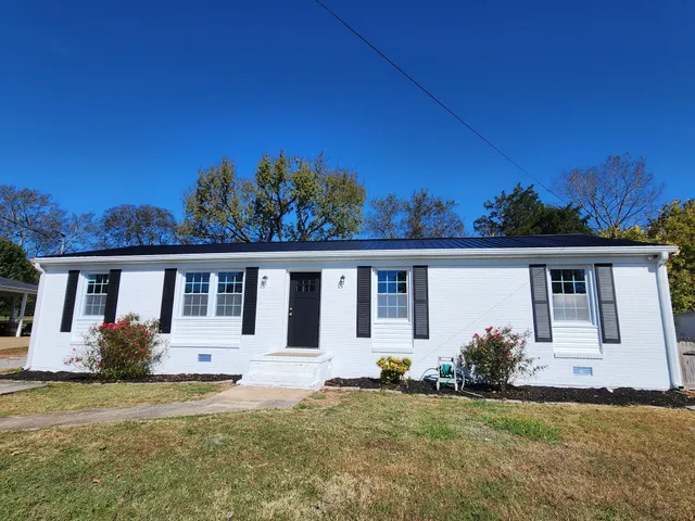 front view of a house with a yard