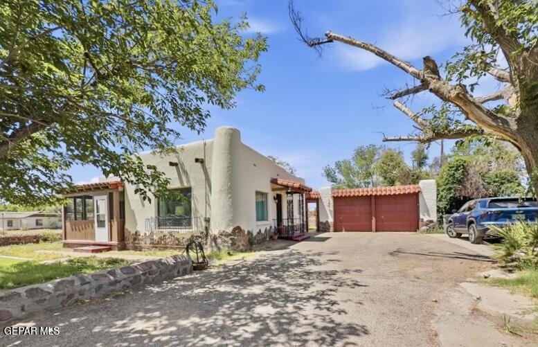 4135 Emory Road El Paso, TX 79922 - Photo 15 of 73 a row of palm trees in front of a house