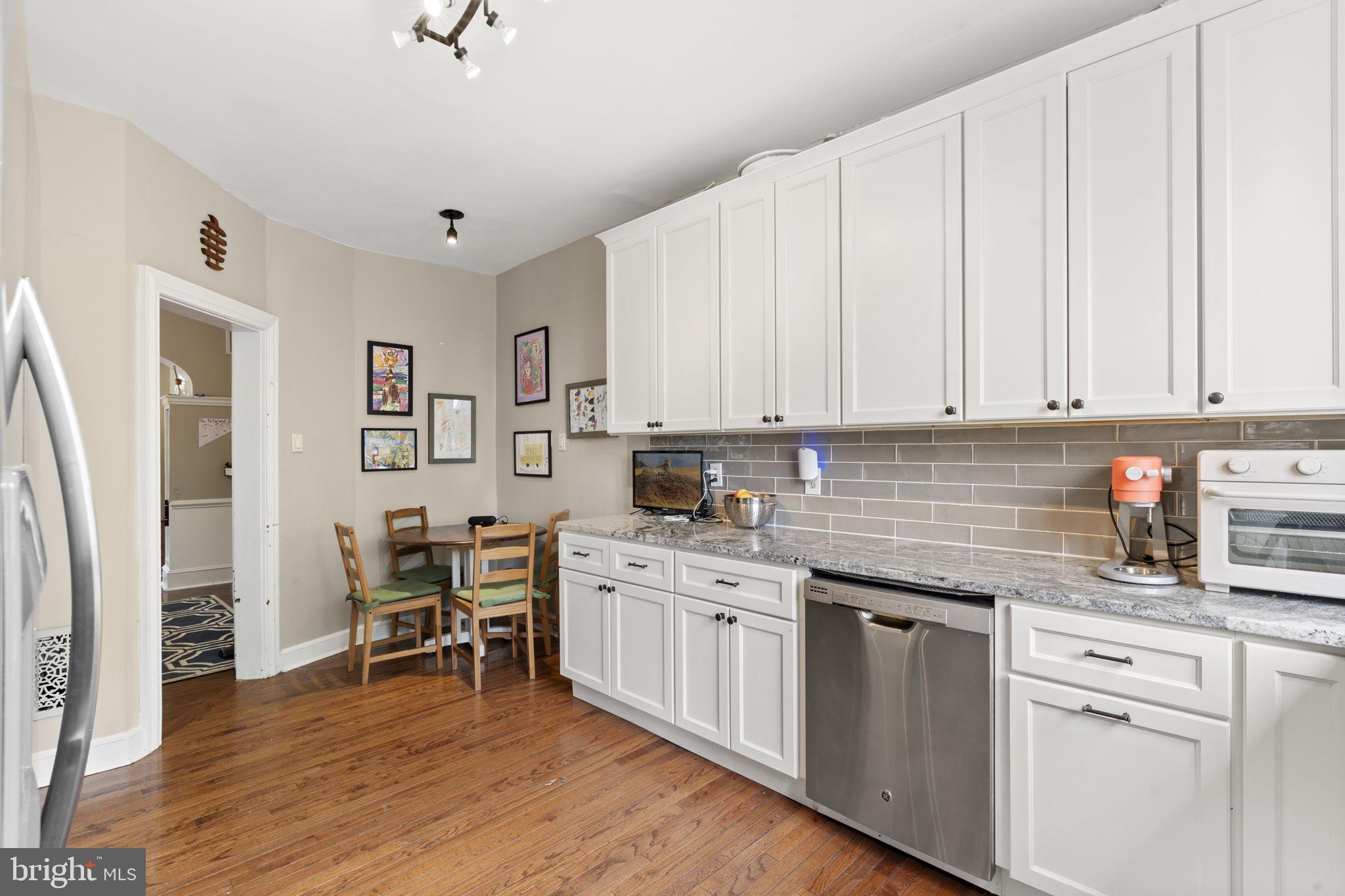 33 Waverly Road Wyncote, PA 19095 - Photo 12 of 28 a kitchen with stainless steel appliances granite countertop white cabinets and sink