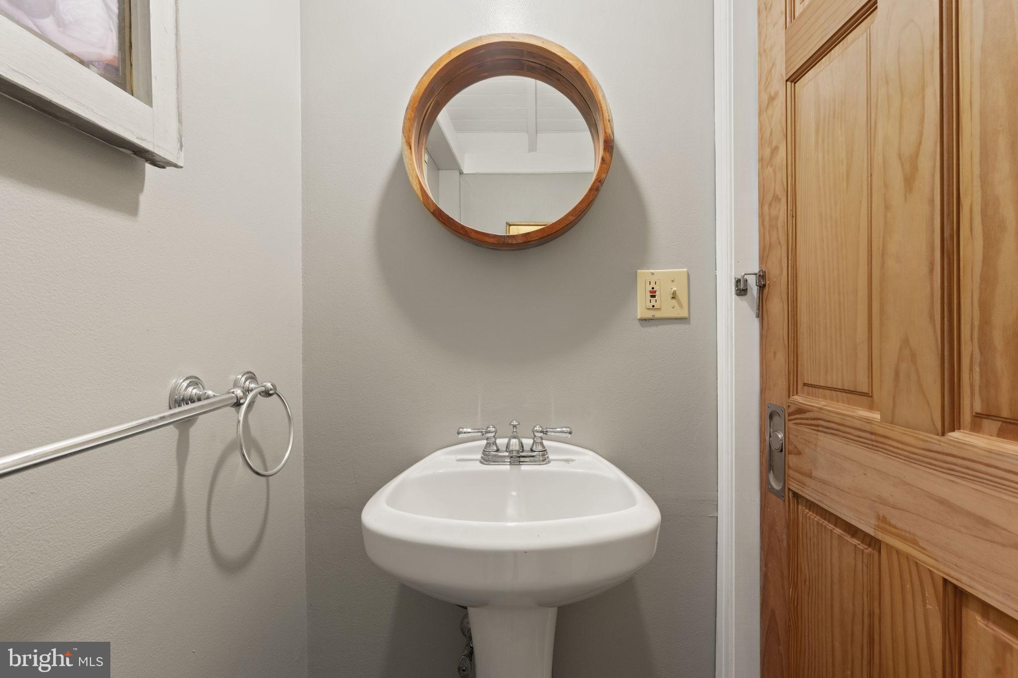 33 Waverly Road Wyncote, PA 19095 - Photo 15 of 28 a bathroom with a sink a toilet and a mirror