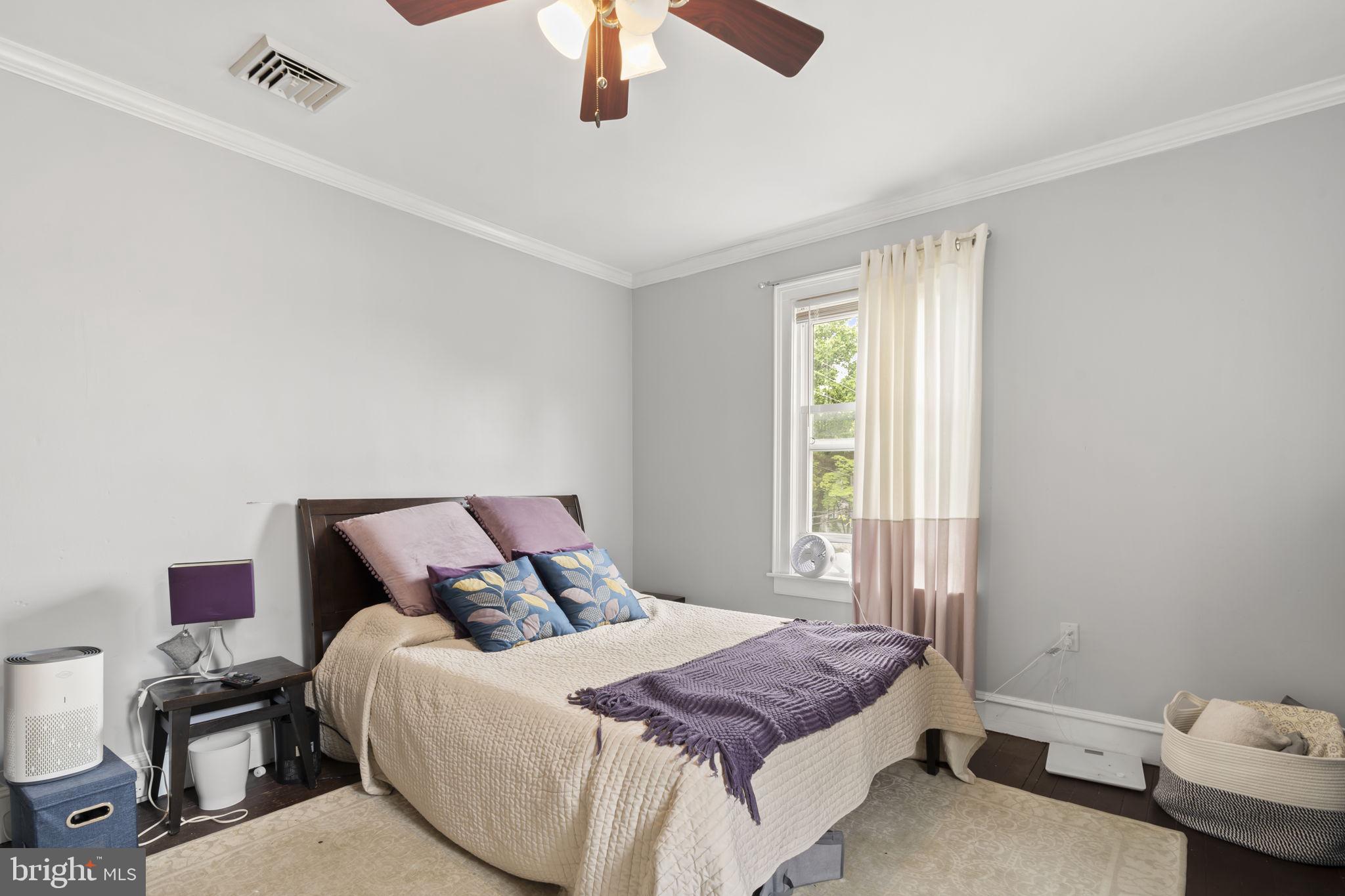33 Waverly Road Wyncote, PA 19095 - Photo 18 of 28 a bedroom with a bed and a chandelier