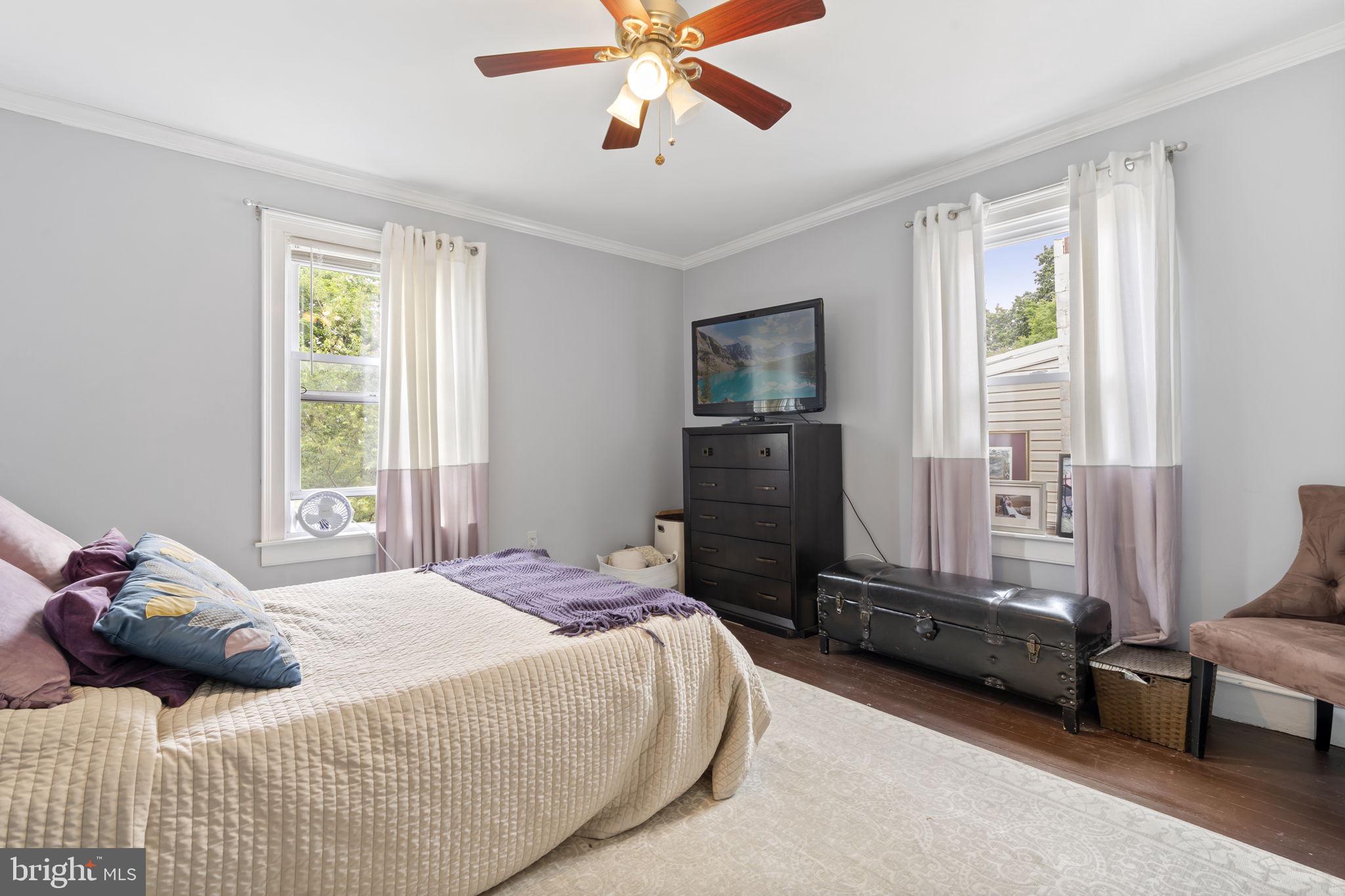 33 Waverly Road Wyncote, PA 19095 - Photo 19 of 28 a bedroom with a bed and a chandelier