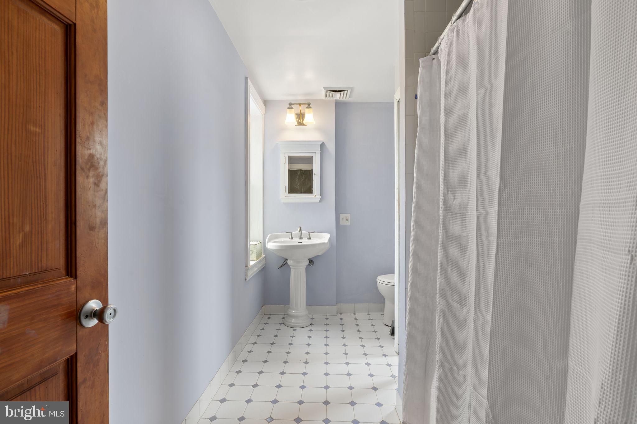 33 Waverly Road Wyncote, PA 19095 - Photo 21 of 28 a bathroom with a sink and a toilet