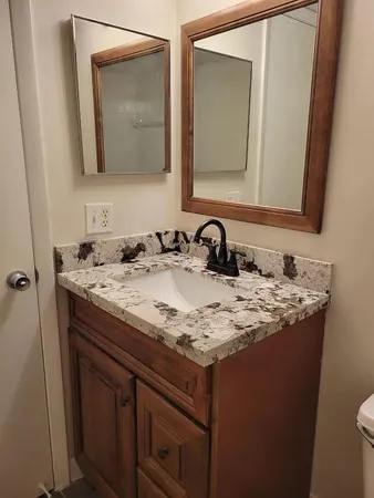 a bathroom with a sink and a mirror