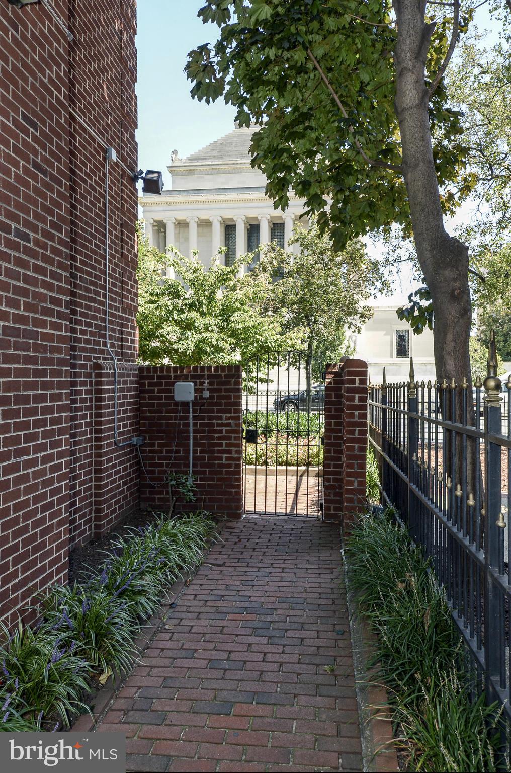 1730 16th Street Northwest, Unit 14 Washington, DC 20009 - Photo 2 of 17 a front view of a house with a garden