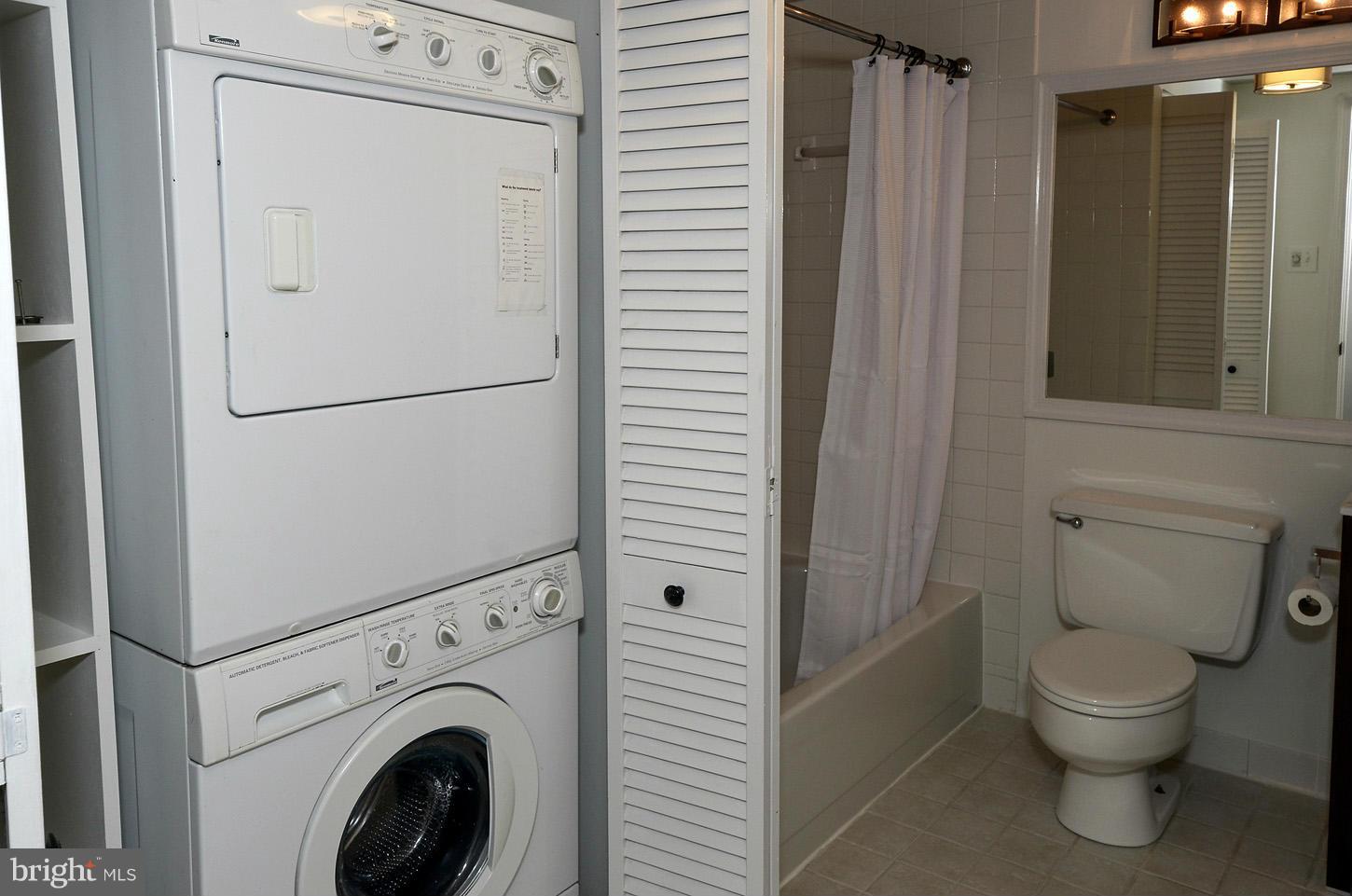 1730 16th Street Northwest, Unit 14 Washington, DC 20009 - Photo 17 of 17 a white toilet sitting next to a bathroom sink
