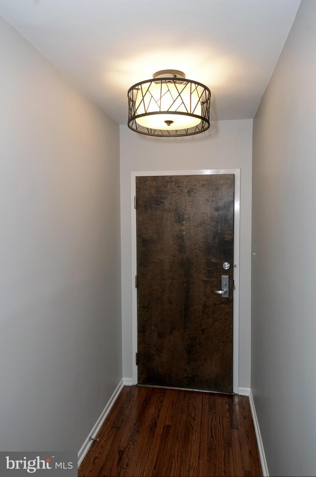 1730 16th Street Northwest, Unit 14 Washington, DC 20009 - Photo 3 of 17 an empty room with wooden floor
