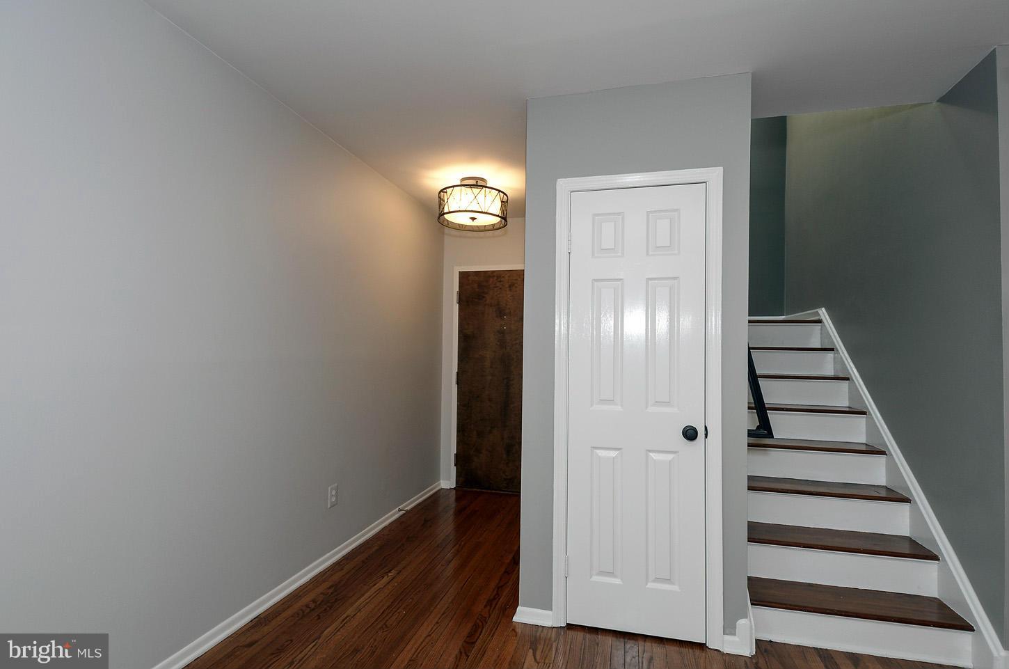 1730 16th Street Northwest, Unit 14 Washington, DC 20009 - Photo 8 of 17 a view of a livingroom with wooden floor and white walls
