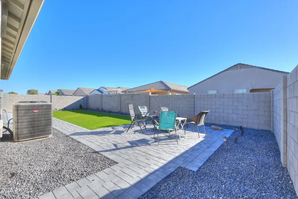 swimming pool view with a seating space