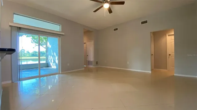 a view of an empty room with a window