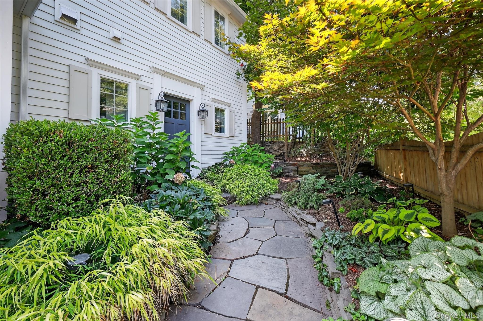 669 Highway 213 Rosendale, NY 12472 - Photo 1 of 34 a front view of a house with a yard and a garden