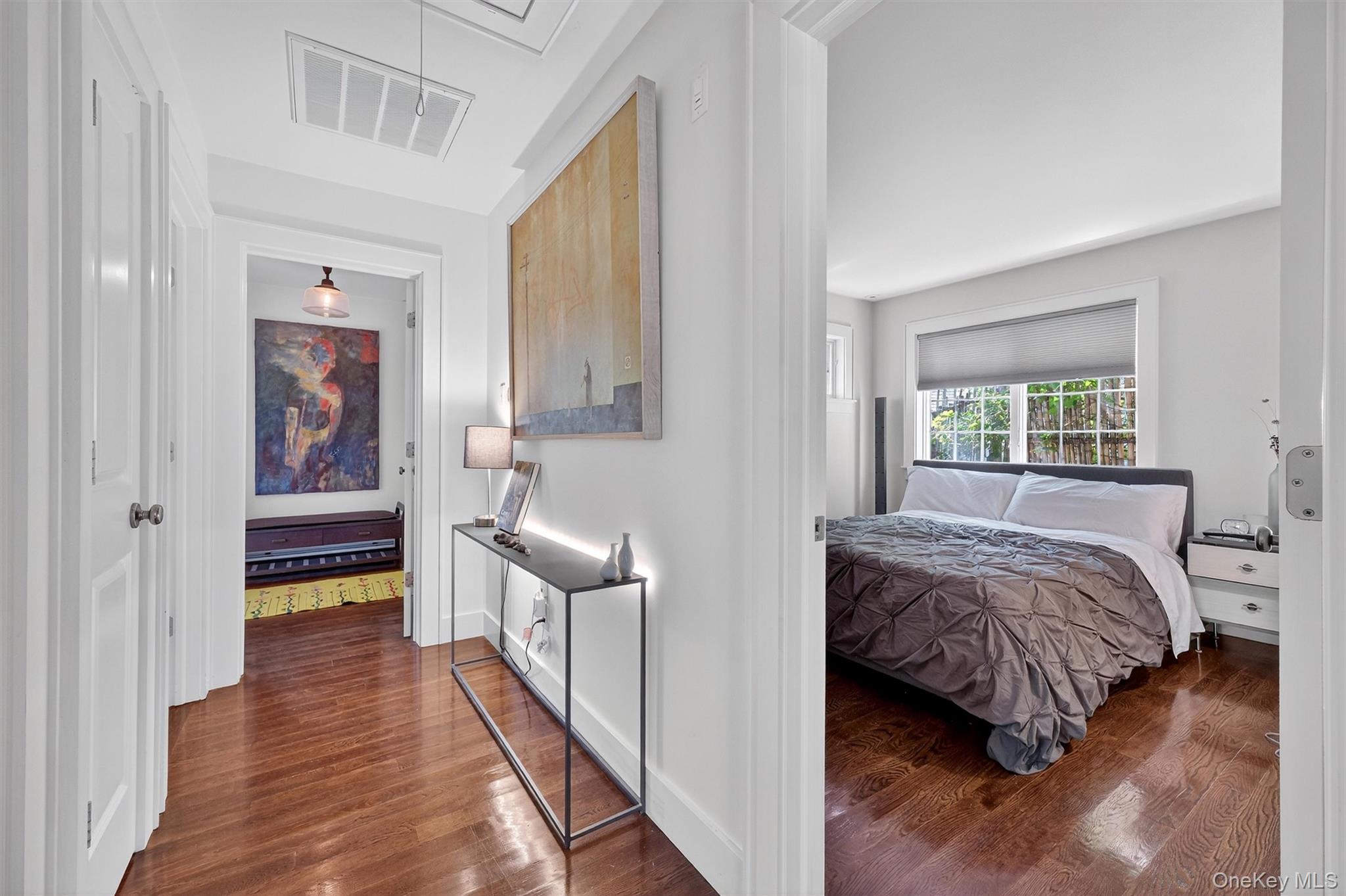 669 Highway 213 Rosendale, NY 12472 - Photo 16 of 34 a bedroom with a bed and a large window with wooden floor