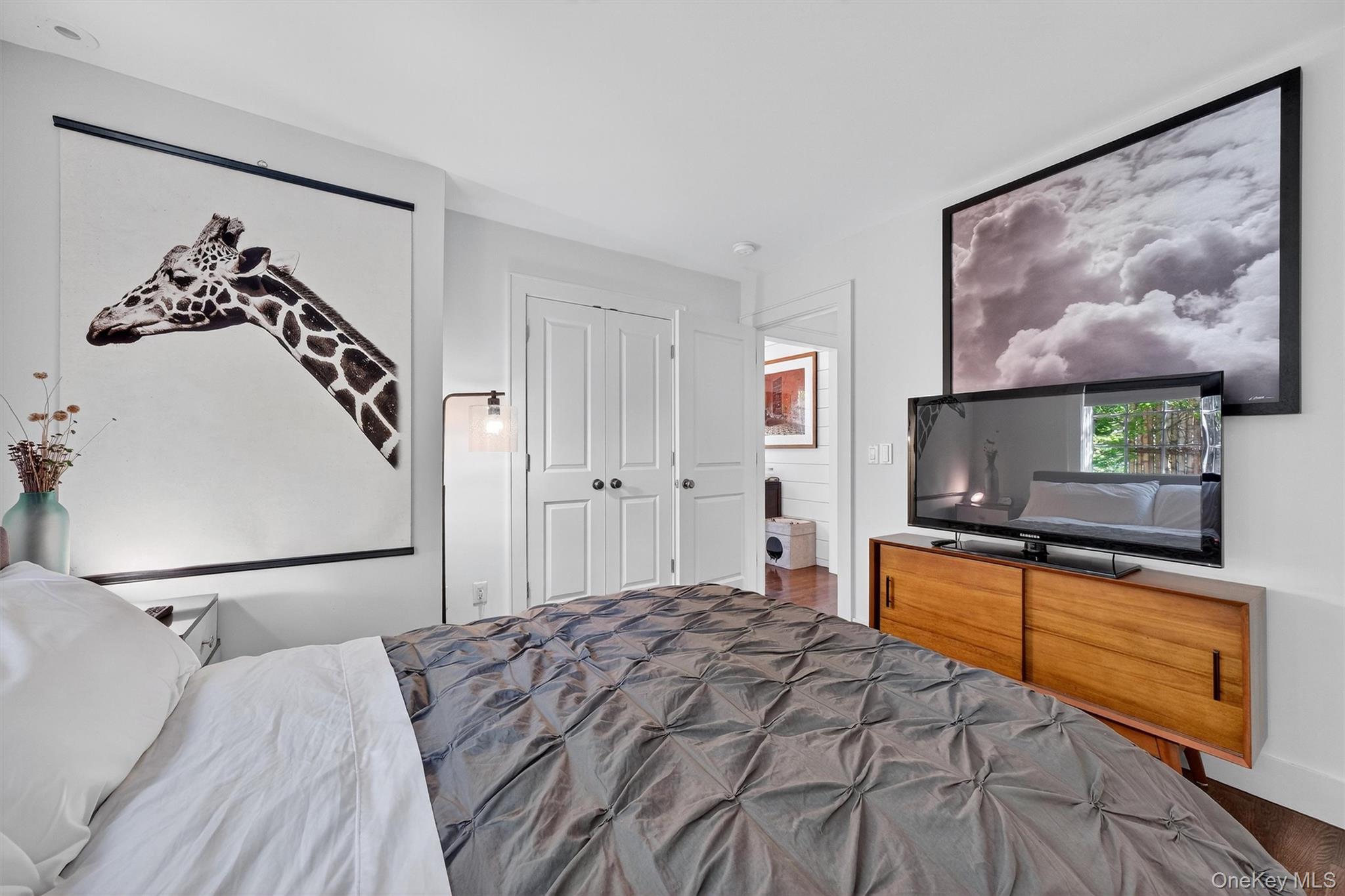 669 Highway 213 Rosendale, NY 12472 - Photo 17 of 34 a bedroom with a bed and a flat screen tv