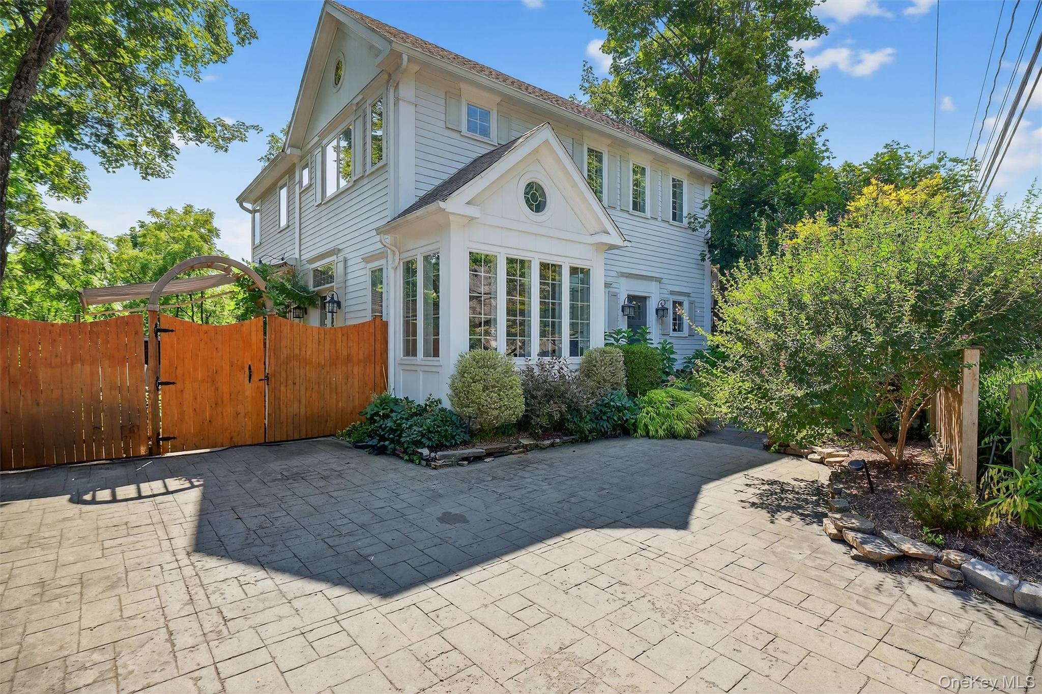669 Highway 213 Rosendale, NY 12472 - Photo 2 of 34 a front view of a house with a garden