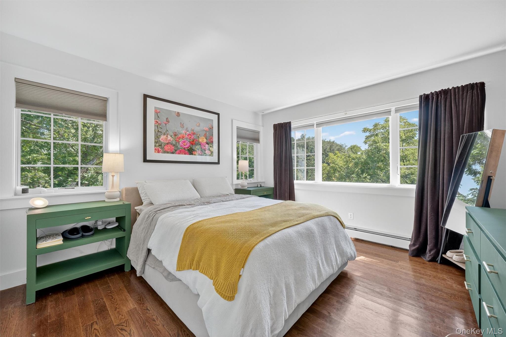 669 Highway 213 Rosendale, NY 12472 - Photo 23 of 34 a bedroom with a large bed and a flat tv screen on a dresser