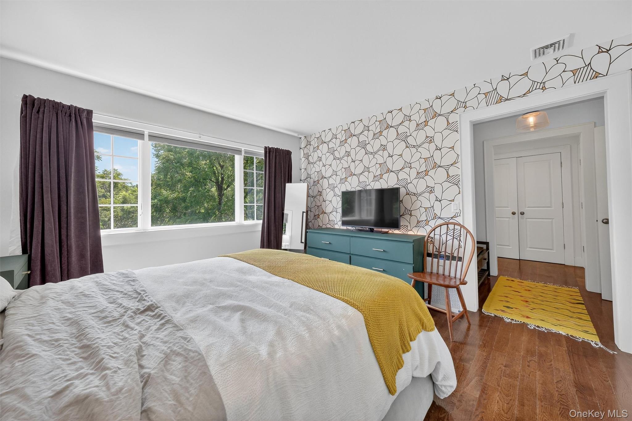 669 Highway 213 Rosendale, NY 12472 - Photo 24 of 34 a bedroom with a bed and a flat screen tv