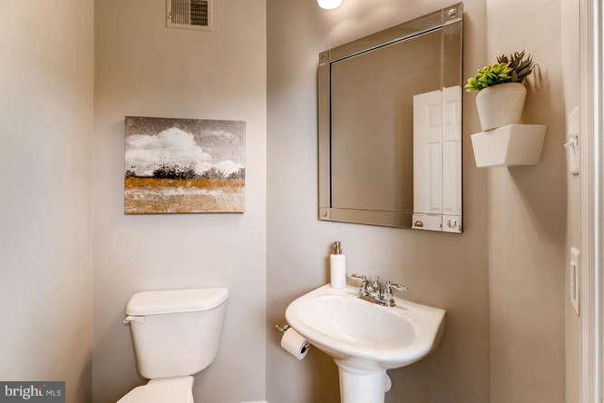 5136 Key View Way Perry Hall, MD 21128 - Photo 17 of 28 a bathroom with a toilet sink and mirror
