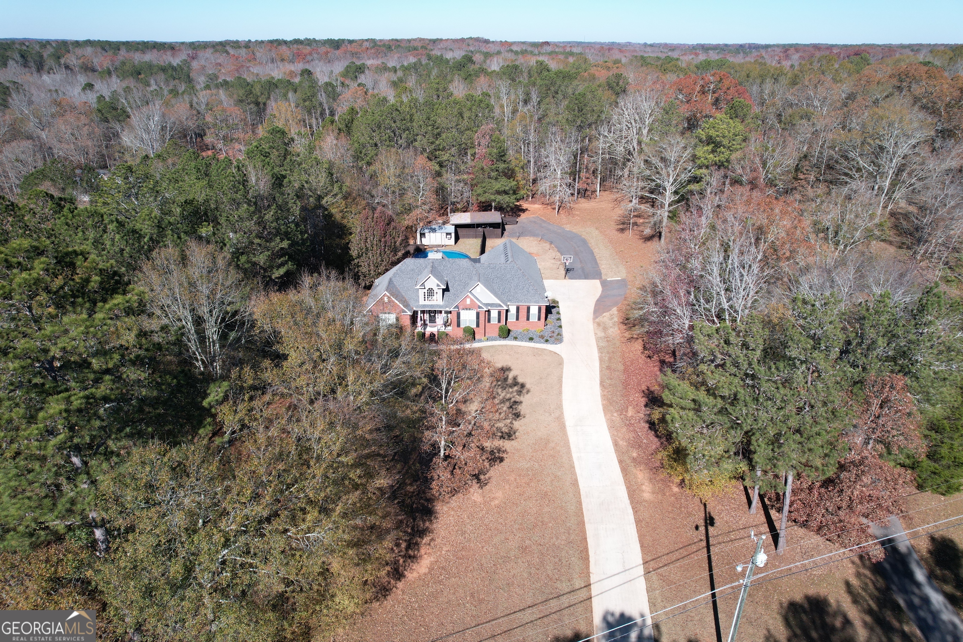 430 Bethany Road Covington, GA 30016 - Photo 2 of 39 a view of a city with lush green forest