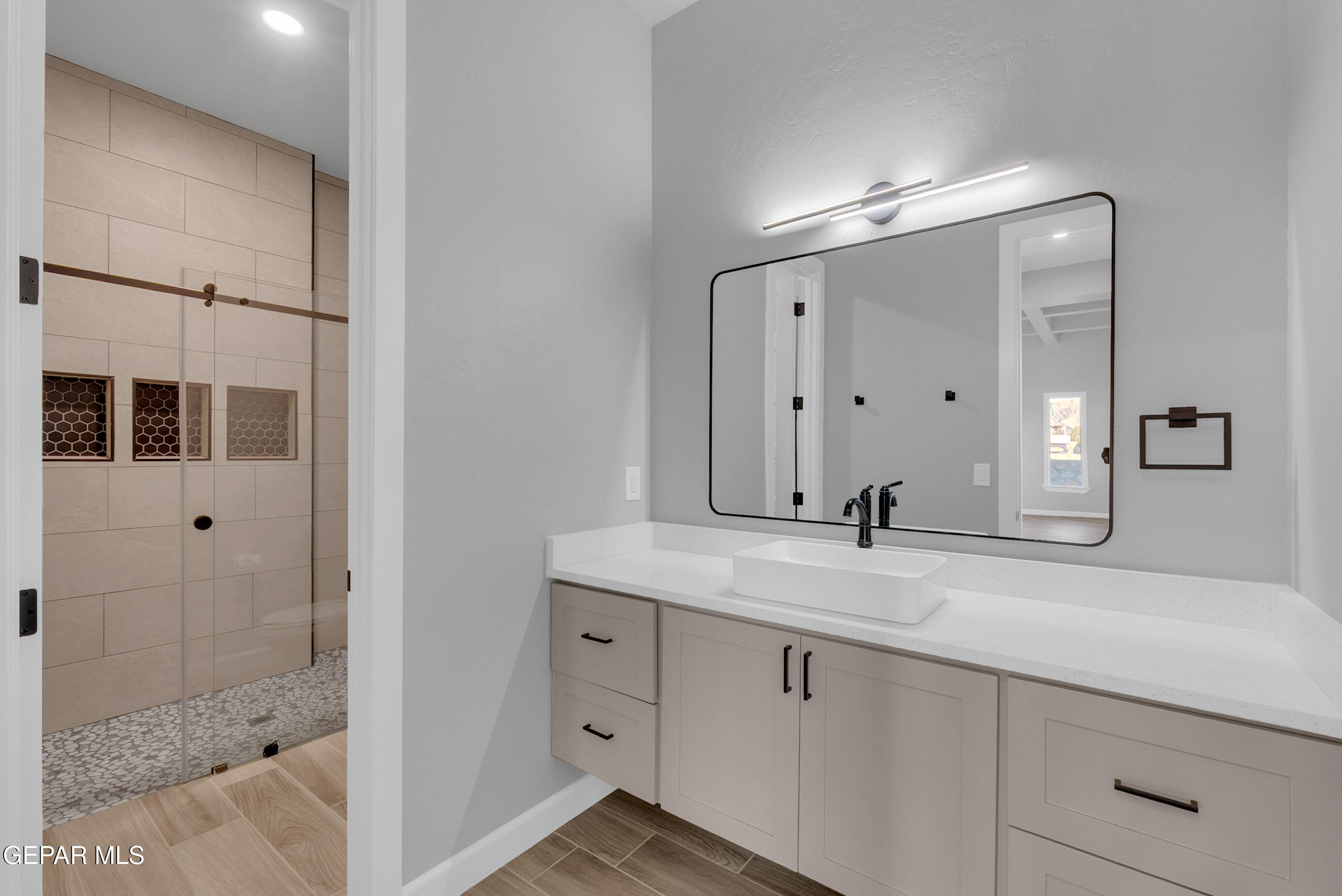 5612 Rio Bonito Circle El Paso, TX 79932 - Photo 16 of 79 a bathroom with a sink and a mirror