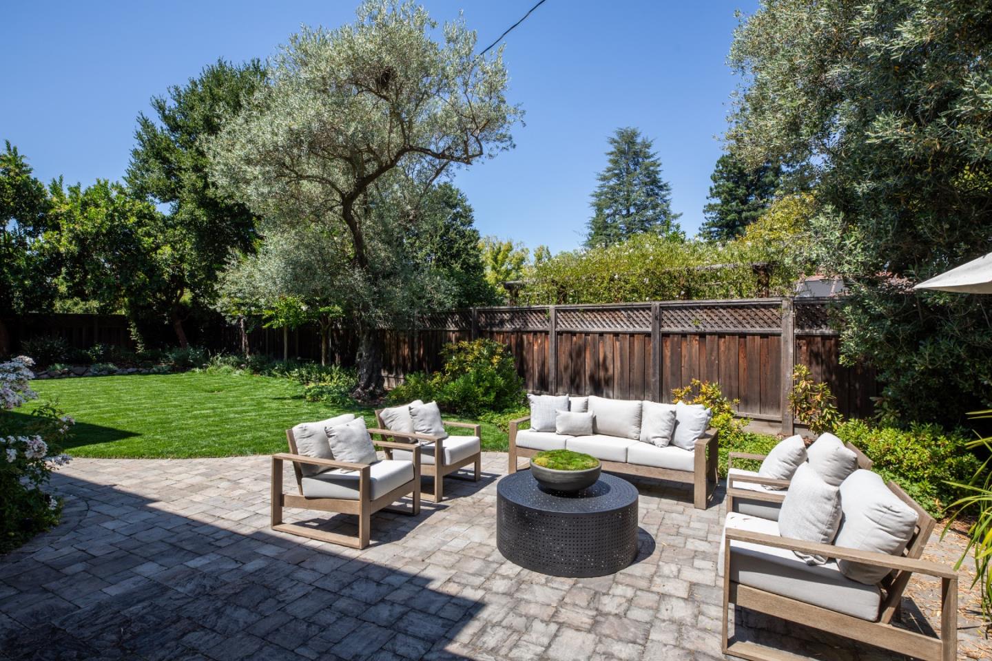 620 Windsor Drive Menlo Park, CA 94025 - Photo 17 of 18 a view of a patio with couches chairs and a table and chairs