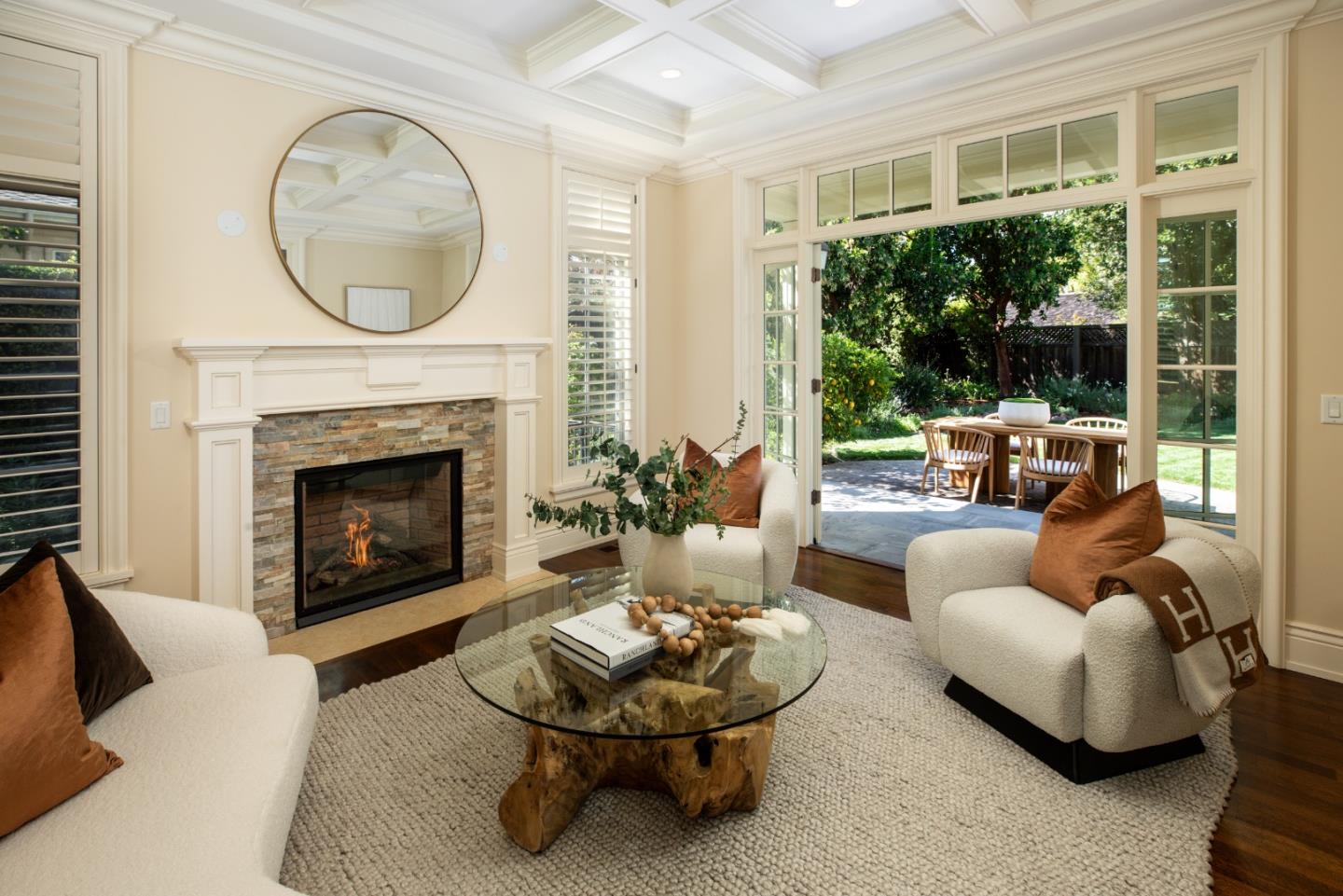 620 Windsor Drive Menlo Park, CA 94025 - Photo 2 of 18 a living room with furniture a fireplace and a large window
