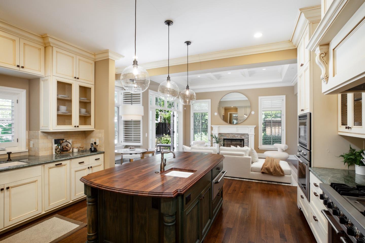 620 Windsor Drive Menlo Park, CA 94025 - Photo 4 of 18 a kitchen with stainless steel appliances granite countertop a sink stove and wooden cabinets