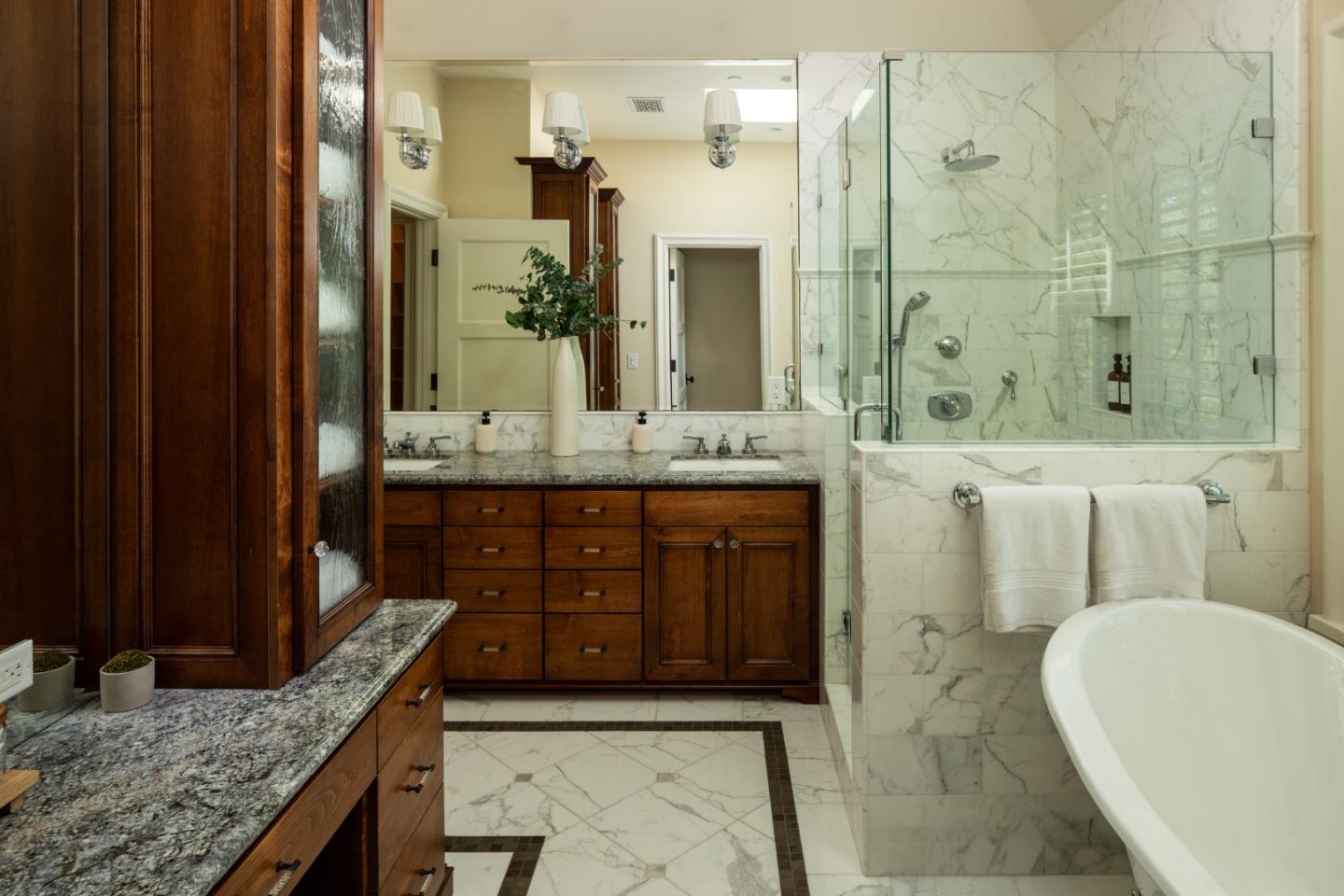 620 Windsor Drive Menlo Park, CA 94025 - Photo 8 of 18 a bathroom with a granite countertop sink a toilet a mirror and shower