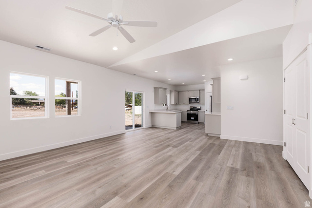 51 West 500 South Monroe, UT 84754 - Photo 17 of 41 Open-concept living area featuring light wood-finish flooring and a contemporary ceiling fan