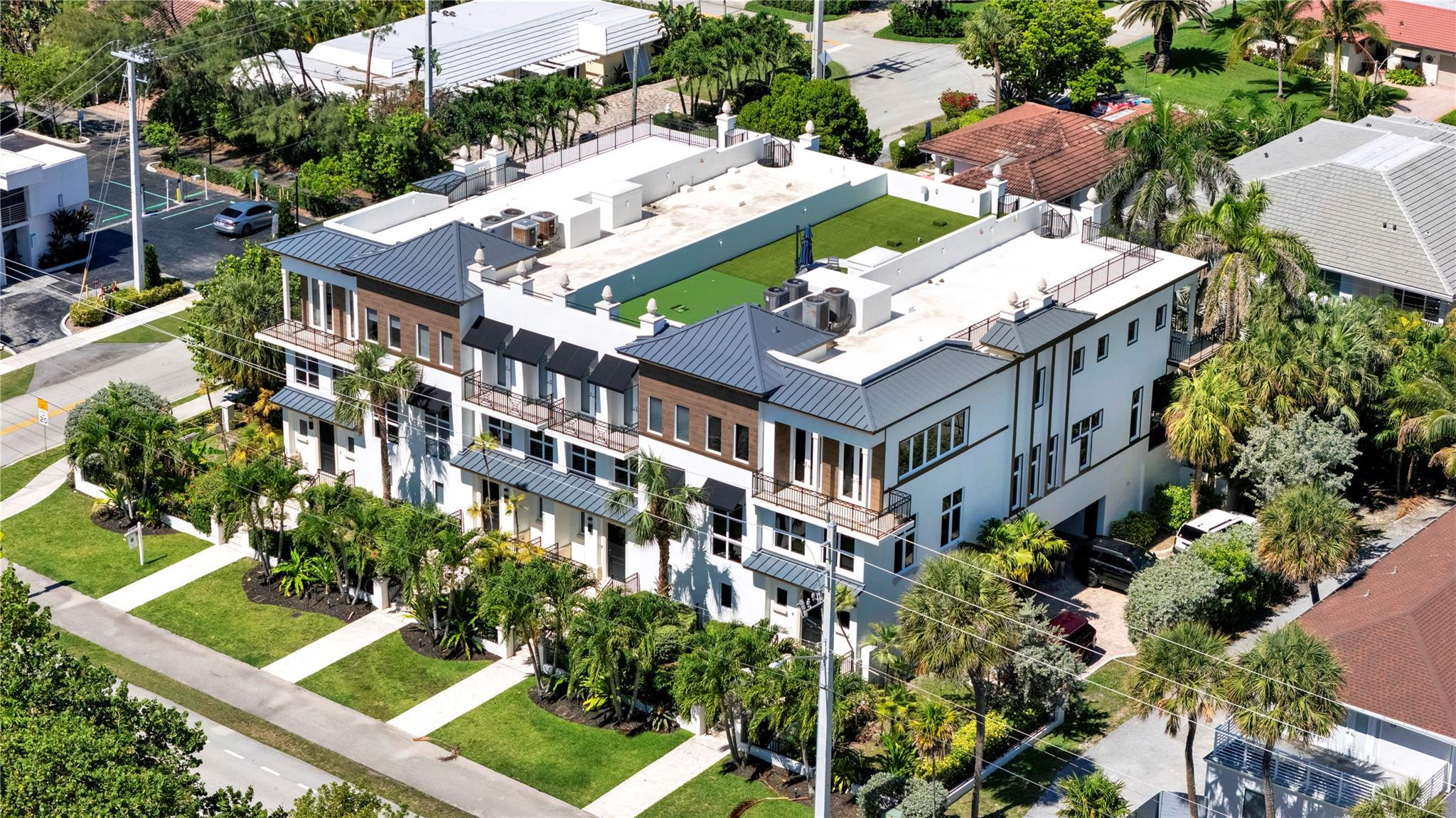 425 North Ocean Boulevard, Unit 3 Boca Raton, FL 33432 - Photo 63 of 69 an aerial view of a house with a yard potted plants and large trees