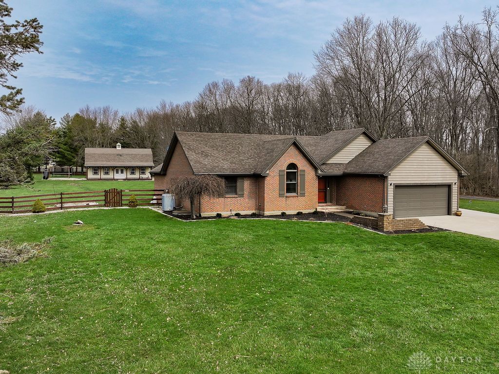 7400 Cook-Jones Road Waynesville, OH 45068 - Photo 14 of 72 This charming residence features a classic brick exterior and an attached garage.