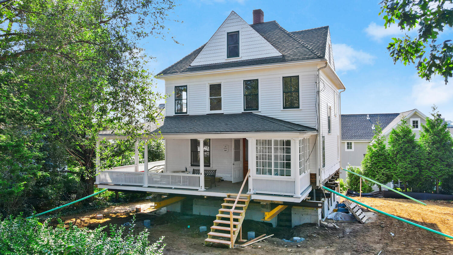 31 Yarmouth Road Rowayton, CT 06853 - Photo 1 of 15 a front view of a house with a yard