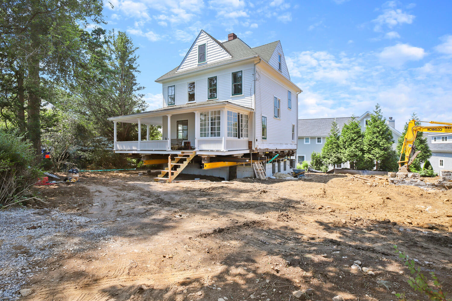 31 Yarmouth Road Rowayton, CT 06853 - Photo 2 of 15 a view of a house with snow on the background