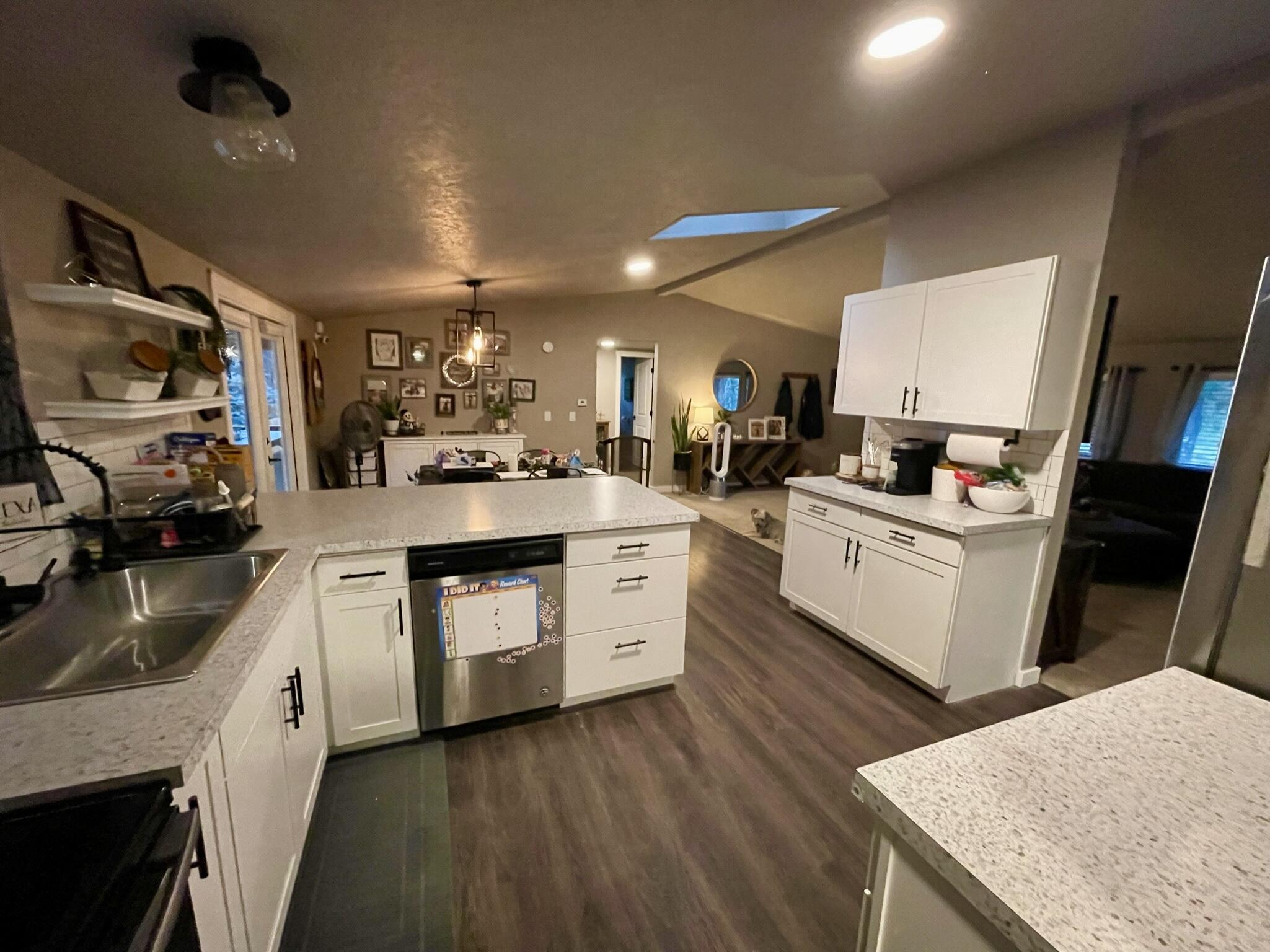 17317 Jacinto Road Bend, OR 97707 - Photo 6 of 25 a kitchen with granite countertop a sink stove and cabinets