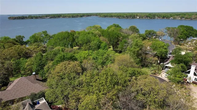 a view of a lake with houses in the back