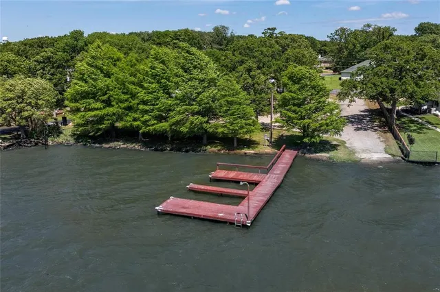 a view of a wooden fence with potted plants