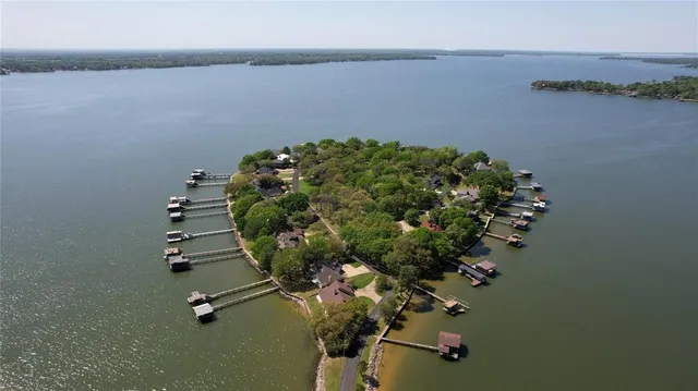 an aerial view of a house with a lake view
