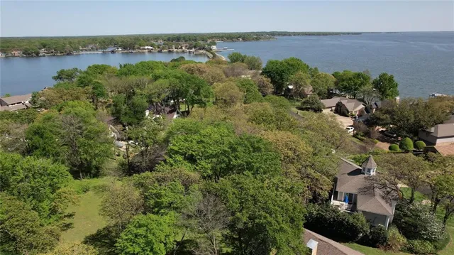 a view of a lake with houses in the back