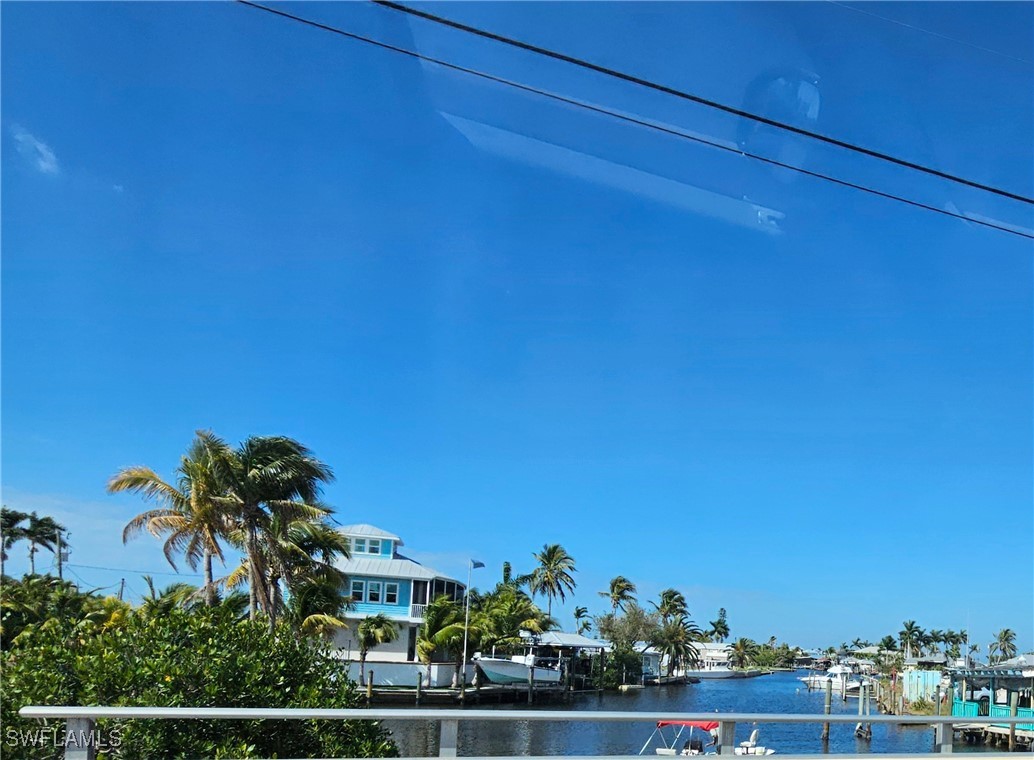 10796 Russell Road Bokeelia, FL 33922 - Photo 18 of 47 a view of a house with a street