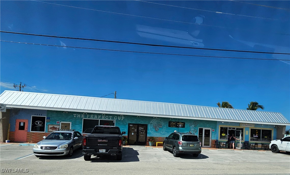 10796 Russell Road Bokeelia, FL 33922 - Photo 19 of 47 a car parked in front of a building